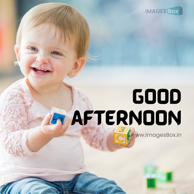 A Caucasian baby girl is indoors at a daycare.-Good Afternoon Baby Images