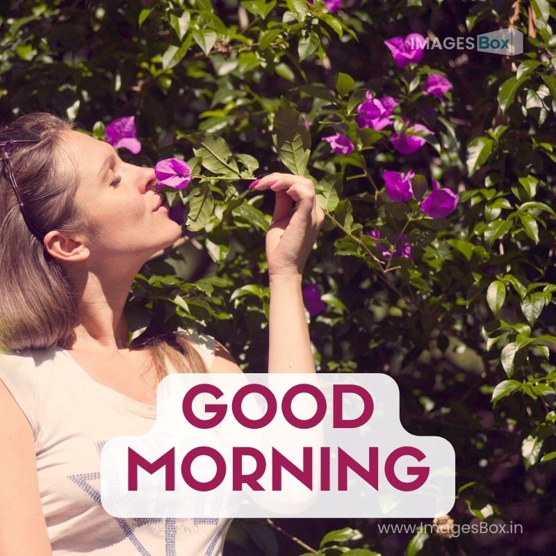 Woman Sniffing Flower good morning photo
